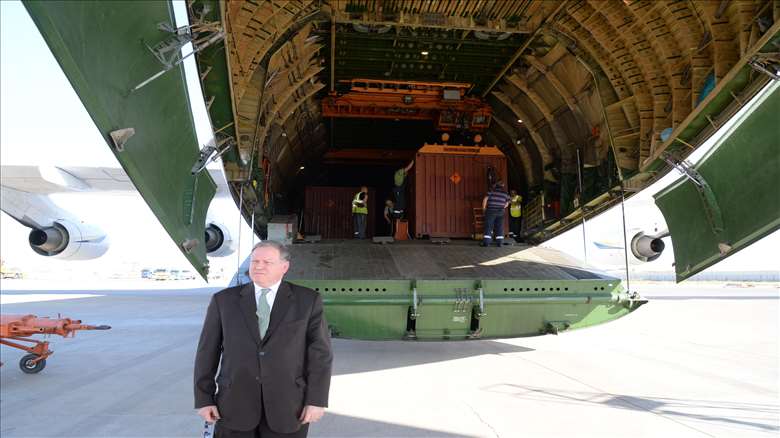 French Consul standing in front of the plane that transferred French weapons to Erbil. 